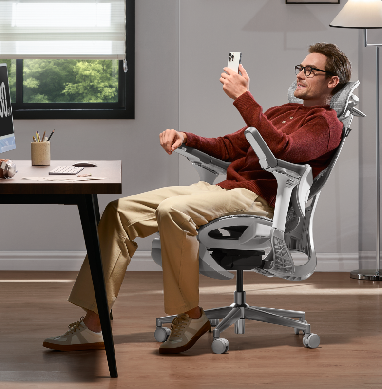 Person reclining in an ergonomic office chair