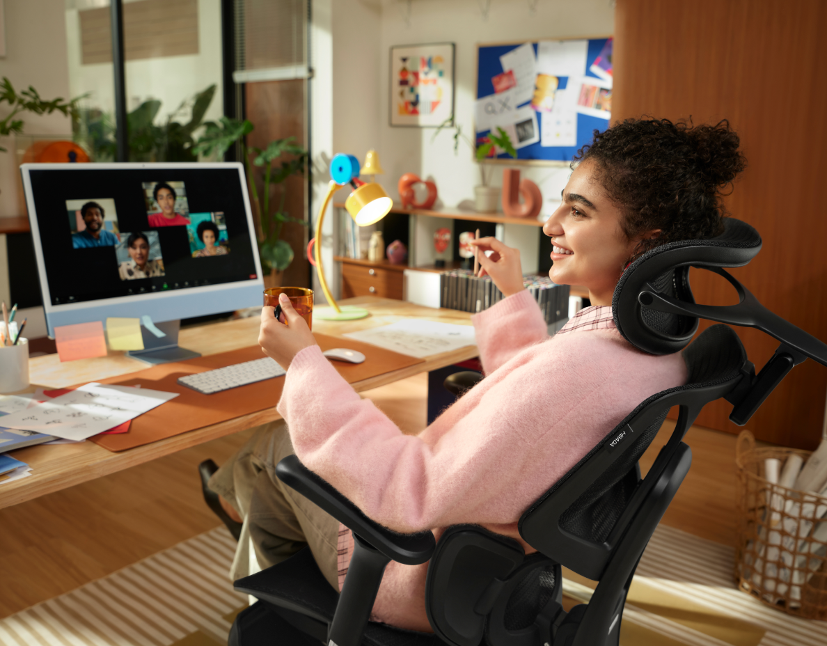 Person seated at a desk in a home office